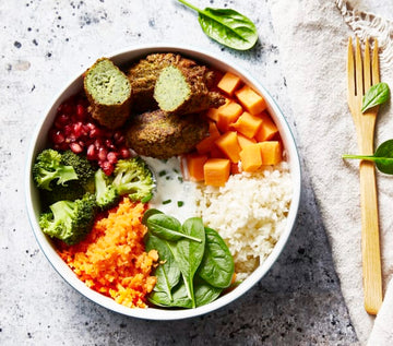 Buddha bowl with lentil falafel and pomegranate