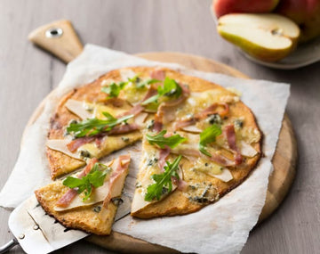 Cauliflower and ricotta pizza bases with blue cheese, pear and prosciutto