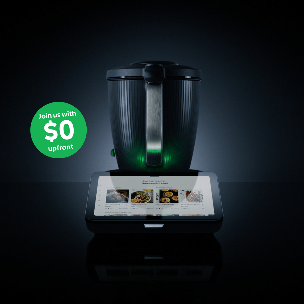 Black kitchen appliance with digital display on a dark background, featuring a promotional message.