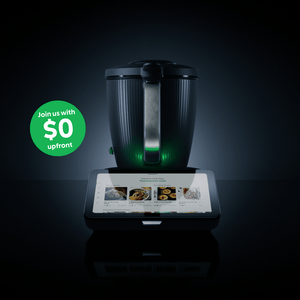 Black kitchen appliance with digital display on a dark background, featuring a promotional message.