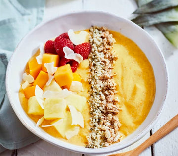 Tropical smoothie bowl with raspberries and hemp seeds