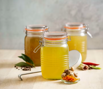 Turmeric and ginger-infused chicken broth